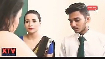 Indian Village School Teacher Helps Student With Homework